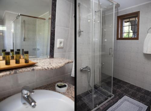 łazienka z przeszkloną kabiną prysznicową i umywalką w obiekcie Aori Hillside Villa w mieście Kántanos