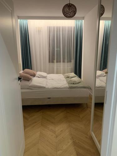 מיטה או מיטות בחדר ב-Forest Apart I