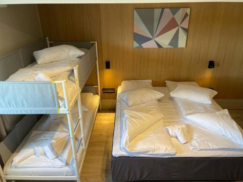 מיטה או מיטות בחדר ב-Apartments no Horten