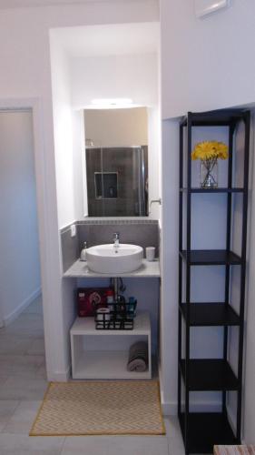 a bathroom with a sink and a mirror at Casa Da Cri in Rapallo