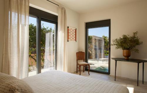 Ένα ή περισσότερα κρεβάτια σε δωμάτιο στο Citrus Grove Luxury Villas