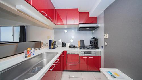 Köök või kööginurk majutusasutuses メルシアター鈍色の風・最上階デザイナーズルーム