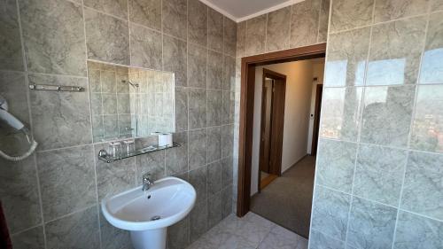 a bathroom with a sink and a shower at Hotel Gorna Banya in Sofia