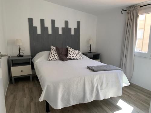 Posteľ alebo postele v izbe v ubytovaní Atico Casa Mari