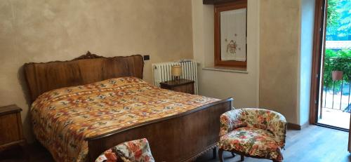Säng eller sängar i ett rum på Il Giardino del Gallo