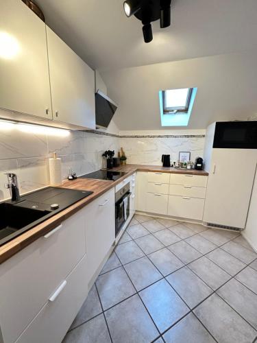 Η κουζίνα ή μικρή κουζίνα στο Ferienwohnung Haus Reindl