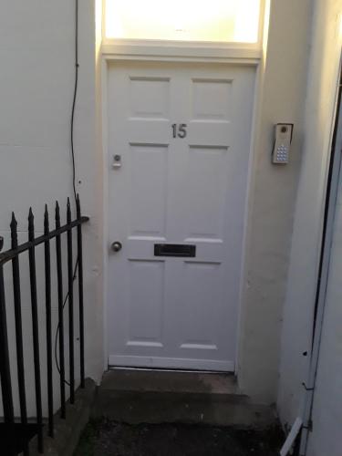 a white door with a window on top of it at Jaskar studio 2 in Cheltenham