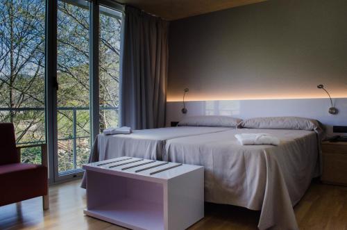 Cama o camas de una habitación en Hospedería Valle del Jerte
