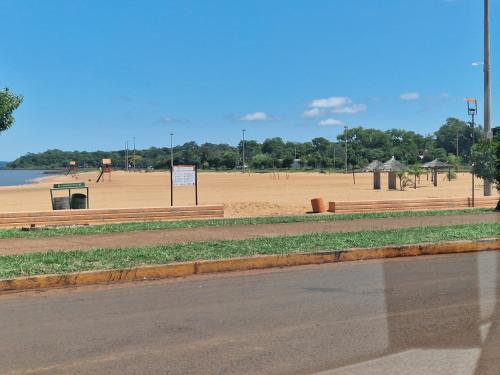 a beach with a volleyball court in the background at Ferienhaus in Paraguay, Encarnacion, 200 Meter vom Parana. in Encarnación