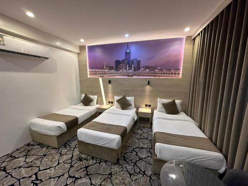 Säng eller sängar i ett rum på فندق اسكنت الحفاير - Askant Al Hafayer Hotel
