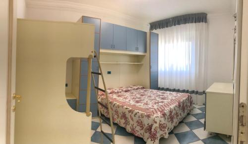 Ένα ή περισσότερα κρεβάτια σε δωμάτιο στο Condominio Ca Brioni