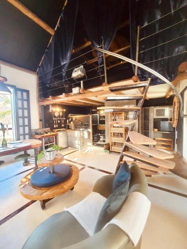 a living room with a couch and a table at Pousada Lua de Charme in Canoa Quebrada
