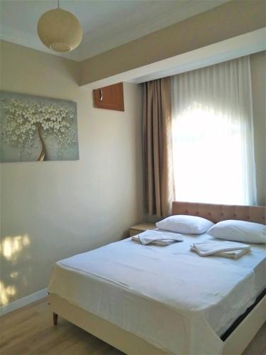 Postel nebo postele na pokoji v ubytování REGA OTEL