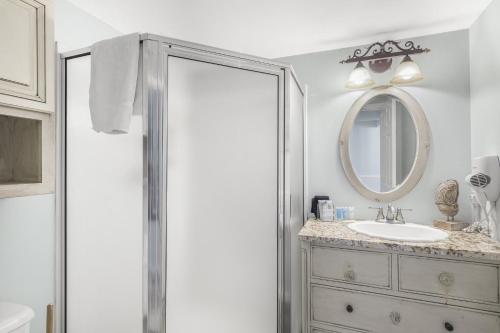 a bathroom with a sink and a mirror at Beach Front 18th Flr, Best Ocean View, New Upgrades in Destin