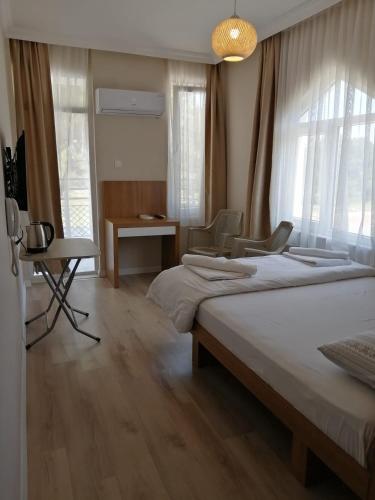 Postel nebo postele na pokoji v ubytování REGA OTEL