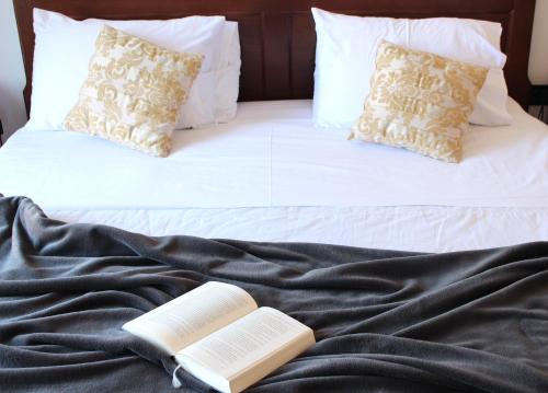 two books sitting on top of a bed at Casa Alice in Rovinj