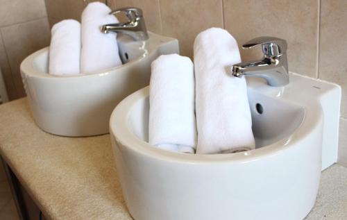 a pile of toilet paper sitting on top of a sink at Casa Alice in Rovinj