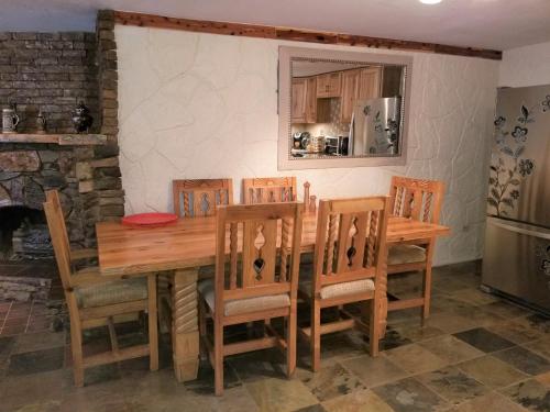 a dining room with a wooden table and chairs at Your comfy home in Colorado Springs in Colorado Springs