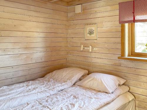 מיטה או מיטות בחדר ב-Holiday home HAMMARÖ
