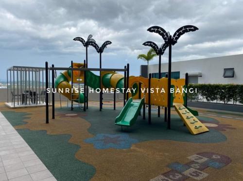 a playground with a slide and a slide at Sunrise Homestay Vista Bangi in Kajang