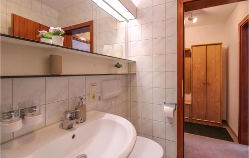 a bathroom with a sink and a toilet at Nice Apartment In Oberreute With House A Mountain View in Oberreute