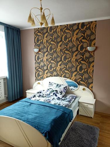 a bedroom with a bed and a wall at Apartamenty na skarpie in Szczecin