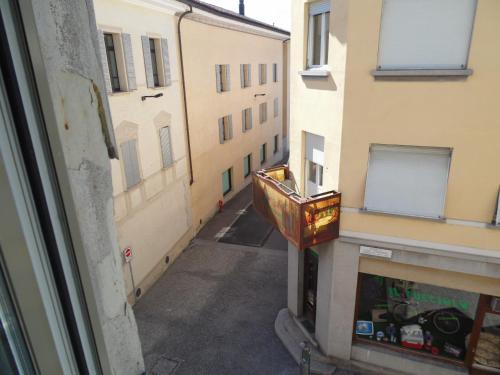 a view of an alley from a window of a building at Garni Bar Sport in Mendrisio