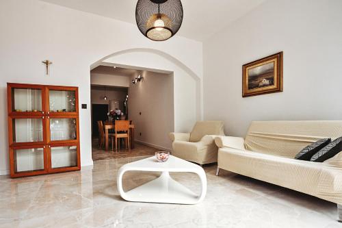 a living room with a couch and a table at villa Ana in Preko