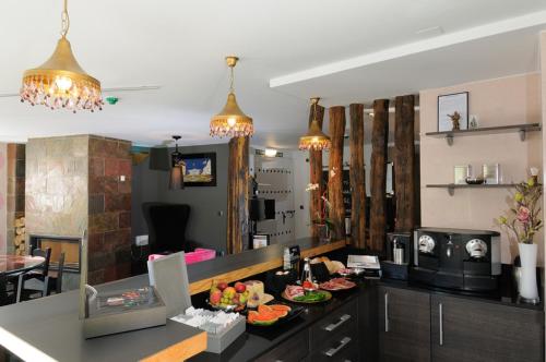 a kitchen with a counter with plates of food on it at Hotel Aldori Landetxea - Reserva de la Biosfera Urdaibai - Adults Only in Muxika