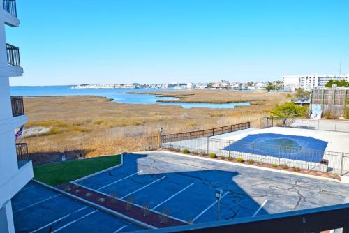 a view of the beach from the balcony of a building at Bay Princess 211 in Ocean City