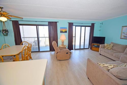 a living room with a couch and a table at Bay Princess 211 in Ocean City