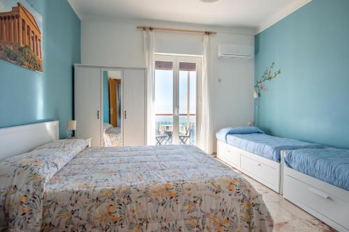 Postel nebo postele na pokoji v ubytování B&B MiraValle Agrigento