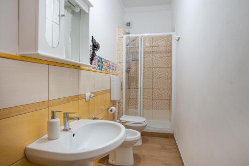 a bathroom with a sink and a toilet at B&B MiraValle Agrigento in Agrigento