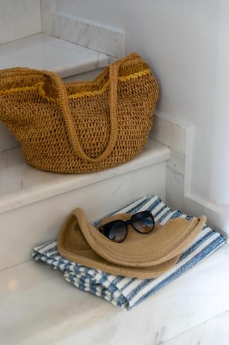 a pair of glasses and a purse sitting on a shelf at khouse - Personal Paradise in Neos Marmaras