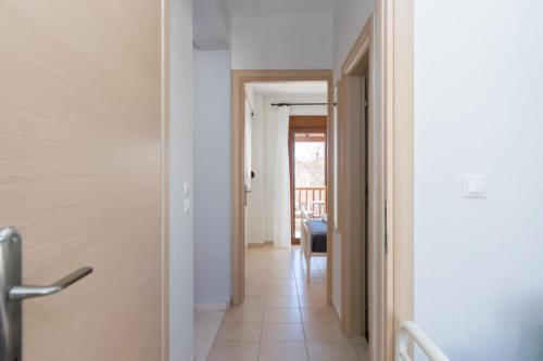 a hallway with a door leading into a room at khouse - Personal Paradise in Neos Marmaras