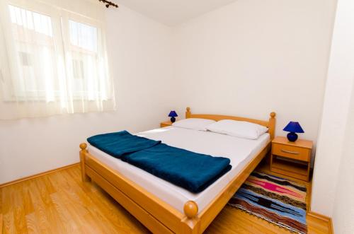 Postel nebo postele na pokoji v ubytování Ciovo view apartments