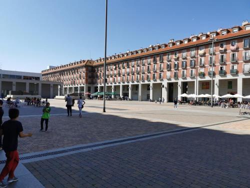 a large building with people walking in front of it at Villa "Luna de Segovia" in Leganés