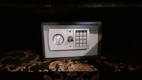 a close up of a microwave oven with a table at L'Empire D'Essences Appartement in Valréas