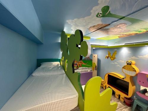 a childs room with a cactus themed bedroom at Kaohsiung High Fun Hostel in Kaohsiung
