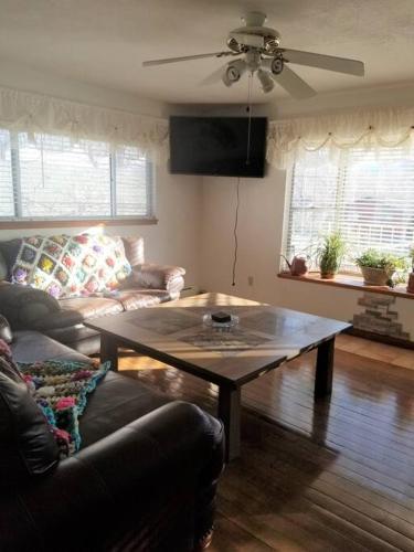 a living room with a coffee table and a couch at Your home in Colorado Springs in Colorado Springs