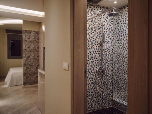 a bathroom with a shower in a room at Laura Suites in Zakynthos Town