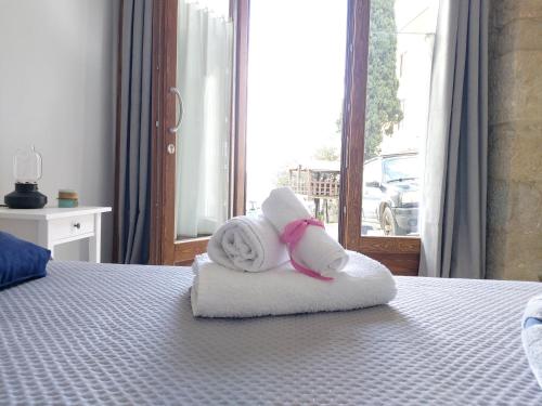 a towel animal sitting on top of a bed at B&B TraMonti in Cusano Mutri