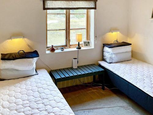 Postel nebo postele na pokoji v ubytování Holiday home Ljugarn II