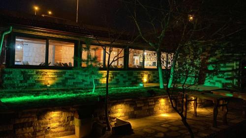 a building with green lights in front of a window at Begam Butik Otel in Avanos