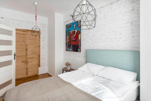 Postel nebo postele na pokoji v ubytování Apartament Roxy Q4Apartments