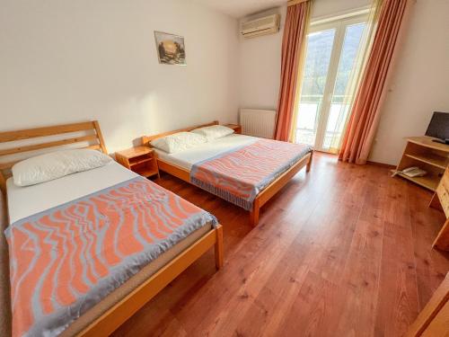 Łóżko lub łóżka w pokoju w obiekcie Hotel & Restaurant Babic