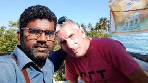 two men are standing next to each other at Thendralhomestay in Puducherry