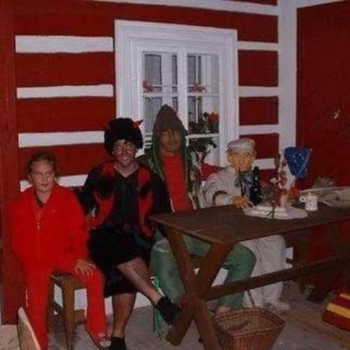 a group of people sitting around a table in a room at Roubenka Mlýn u skály Deštné v Orlických horách volné termíny 5 bytů in Deštné v Orlických horách
