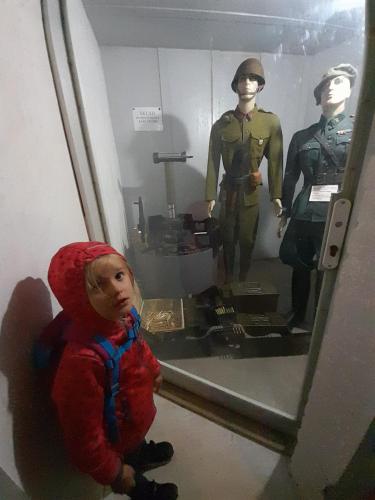 a child standing next to a mannequin in a museum at Roubenka Mlýn u skály Deštné v Orlických horách volné termíny 5 bytů in Deštné v Orlických horách