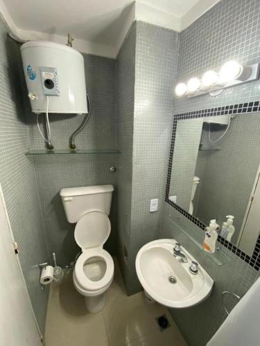 a small bathroom with a toilet and a sink at Boutique Studio Recoleta in Buenos Aires